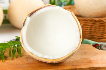 Fresh Coconut Half with Coconut Milk on Wooden Board - Tropical King Coconut Pictures