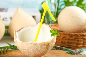 Fresh Coconut Milk in Natural Shell with Straws - Tropical Drink Concept