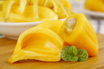 Fresh Vietnamese Honey Pineapple Slices with Golden Yellow Flesh and Mint Garnish on Wooden Board