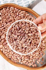 Colorful Pinto Beans in Bowl and Wooden Container - Fresh Homegrown Legumes for Healthy Cooking and Nutrition