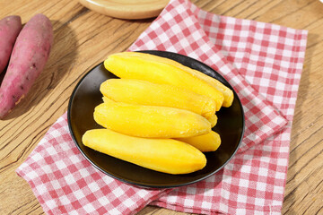 Fresh Yellow Sweet Potato Slices on Dark Plate with Checkered Napkin - Healthy Root Vegetable Food Photography