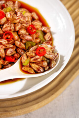 Spicy Marinated Peanuts with Chili Peppers in White Bowl - Traditional Farmers Market Snack Food
