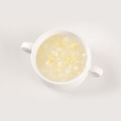 Fresh corn kernels with polenta in white bowl for homemade cooking
