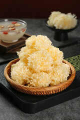 Dried Snow Ear Mushroom Silver Fungus in Bamboo Basket Traditional Chinese Ingredient
