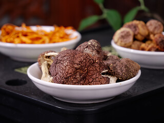 Fresh Morel Mushrooms and Colorful Ingredients in White Bowls for Gourmet Cooking