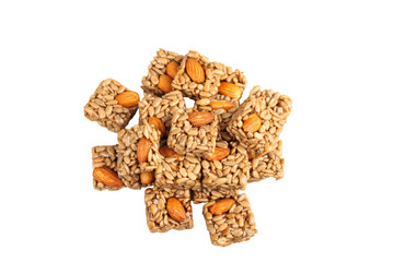 Handmade Crunchy Nut Candy Squares with Almonds on White Background