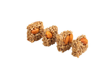 Handmade Nut Brittle Candy with Almonds and Seeds on White Background