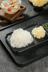 Dried White Snow Fungus Tremella on Black Serving Tray Traditional Asian Cooking Ingredient