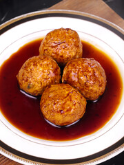 Four Golden Braised Lion's Head Meatballs in Brown Sauce - Traditional Chinese Banquet Specialty Dish