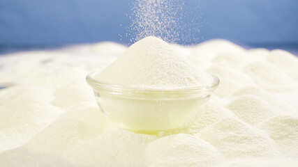 Premium New Zealand White Milk Powder in Glass Bowl with Falling Motion