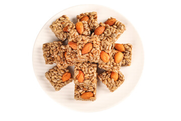 Homemade Granola Bars with Almonds and Seeds on White Plate - Healthy Natural Snack Food