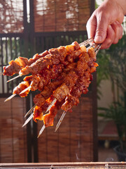Grilled Lamb Kebabs at Night Market Food Stall - Street Food Vendor Serving Fresh Meat Skewers