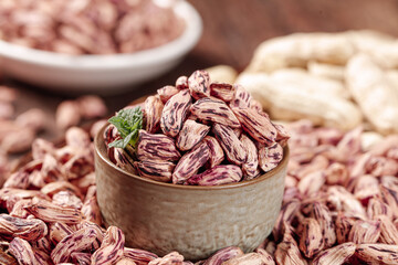 Colorful Speckled Beans in Rustic Wooden Bowl - Organic Legumes and Natural Food Ingredients