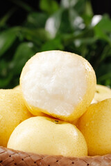 Fresh White Crown Pears from Hebei Province in Wicker Basket with Green Background