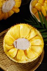 Fresh Thai Honey Pineapple Cut in Half Showing Golden Flesh Segments on Bamboo Plate