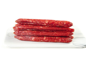 Air-dried Chinese sweet pork sausages Canton style on marble board