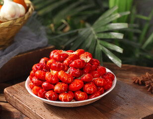 Fresh Qianjiang Lobster Tail Balls Chinese Seafood Delicacy on Wooden Table with Palm Leaves
