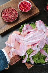 Fresh Raw Frog Legs with Spices and Seasonings for Asian Cooking Preparation