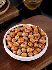Roasted Fava Beans in White Bowl on Wooden Table - Healthy Mediterranean Snack Food