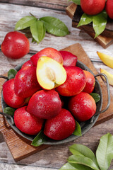 Fresh Dalian Nectarines with Yellow Heart - Ripe Stone Fruit Crop from Shanxi China on Rustic Wooden Background