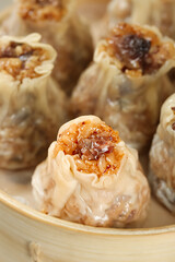 Chinese Siu Mai Dumplings with Pork and Shiitake Mushrooms in Bamboo Steamer - Traditional Dim Sum