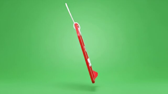 Red sale tag with snowflake icon and white string on a green background, perfect for holiday promotions