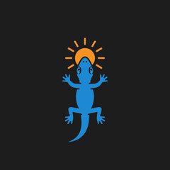 Fototapeta premium Blue lizard silhouette with a sun above its head, set against a dark background.