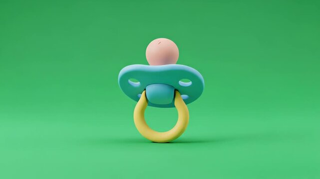 A blue and yellow pacifier with a pink nipple on a green background