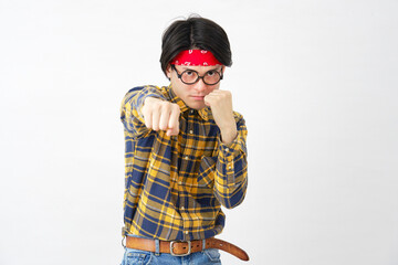 Fototapeta premium パンチするアキバ系の男性 白背景 カメラ目線