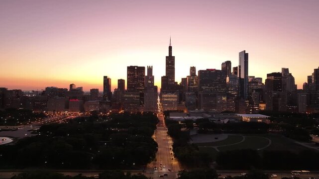 Chicago Skyline at Sunset &ndash; Aerial View of Downtown Cityscape with Vibrant Sky&rdquo; A breathtaking aerial video of Downtown Chicago at sunset, showcasing the city skyline with the Willis Tower and 