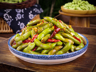 Freshly Boiled Edamame Beans with Chili Peppers in Ceramic Bowl - Traditional Asian Farm Fresh Vegetable Dish