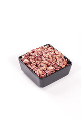 Colorful Farm-Grown Peanut Kernels in Black Bowl on White Background