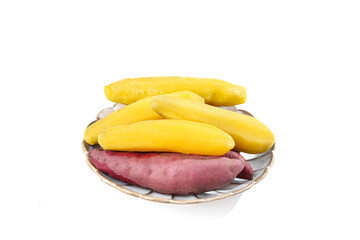 Fresh Fingerling and Sweet Potatoes on Wicker Plate - Small Shaped Varieties for Cooking