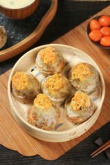 Handmade Siu Mai Dumplings with Sticky Rice and Pork in Bamboo Steamer - Traditional Chinese Dim Sum