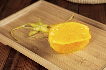 Fresh Ripe Yellow Peach Halves on Wooden Cutting Board with Peeled Skin