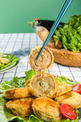 Deep Fried Eggplant Rolls with Chopsticks - Delicious Asian Vegetarian Appetizer on White Plate
