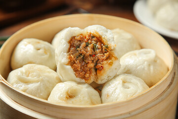 Traditional Shengzhou Xiao Long Bao Dumplings with Meat Filling in Bamboo Steamer - Chinese Cuisine