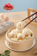 Traditional Shengzhou Xiao Long Bao Dumplings in Bamboo Steamer - Fresh Chinese Meat Cuisine