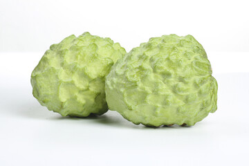 Fresh Kaffir Lime Citrus Fruits with Textured Green Skin on White Background