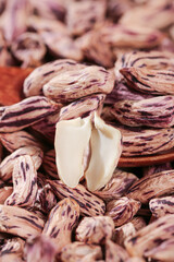 Colorful Pinto Beans Close-up with Split Bean Showing Interior - Appetizing Legume Food Photography