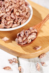 Fresh Pinto Beans in Bowl and Wooden Spoon - Healthy Legumes for Cooking