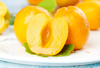 Fresh Ripe Apricots and Plums Cut in Half Showing Natural Juicy Stone Fruits