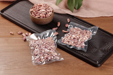 Vacuum Sealed Colorful Striped Beans in Bags with Wooden Bowl Food Storage Preservation