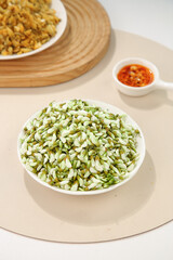 Edible Locust Tree Seed Pods Wild Vegetable Dish with Spicy Sauce on White Wooden Board