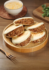 Handmade Chinese Meat Buns Shaanxi Style Marinated Filling Traditional Steamed Baozi on Wooden Serving Plate