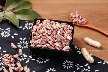 Colorful Pinto Beans and Peanuts on Rustic Wood Surface - Healthy Legumes and Nuts Food Photography