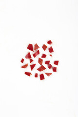 Freshly Picked Red Chili Pepper Pieces Scattered on White Background for Cooking and Spicy Cuisine