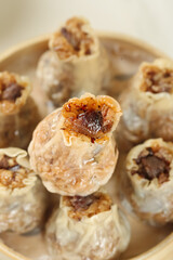 Gourmet Siu Mai Dumplings with Pork Sticky Rice and Shiitake Mushrooms in Bamboo Steamer