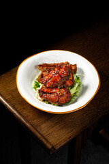 Shanghai Sweet and Sour Fish with Vinegar Glaze - Traditional Chinese Cuisine on Wooden Table