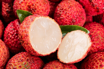 Fresh Hainan Lychee Fruit Cut Open Showing White Flesh - Tropical Asian Coreless Variety from Volcano Region © NgoVan